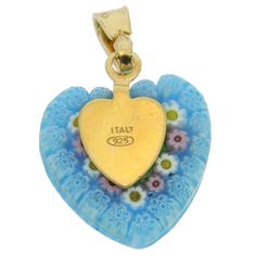 Get into romantic mood and feel like you are magically transported to Venice when you wear this elegant Murano glass heart pendant. Enjoy this fine example of the most famous Murano technique- Millefiori (a thousand flowers)- which has become a trademark of Murano glass making. Stylized flowers in rich colors give this Murano heart pendant artistic and unmistakably Venetian look. This timeless piece of Murano glass jewelry is exquisite and versatile and will look great suspended from any of our Murano Glass Jewelry, Glass Making, Romantic Mood, Heart Pendant Gold, Glass Heart, Rich Colors, Venice Italy, Glass Crafts, Glass Jewelry