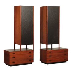 two tall wooden cabinets sitting next to each other