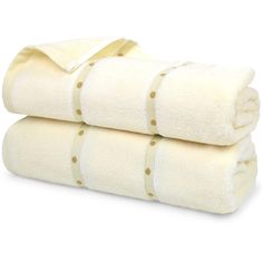 two white towels stacked on top of each other with gold polka dot trimmings