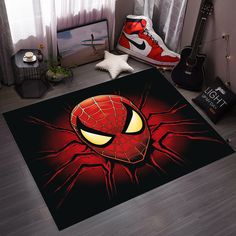 a bedroom with a spiderman rug on the floor next to a guitar and shoes