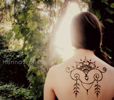 a woman with a tattoo on her back