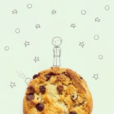 a chocolate chip cookie with a drawing of a man on it