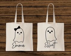 two bags with ghost faces drawn on them