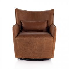 a brown leather chair with a pillow on the back and armrests, sitting in front of a white background