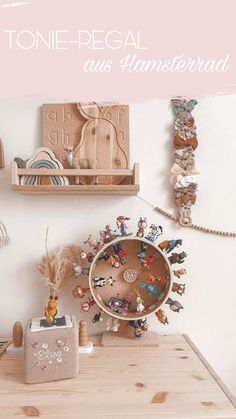 a wooden table topped with lots of toys and decor on it's side wall