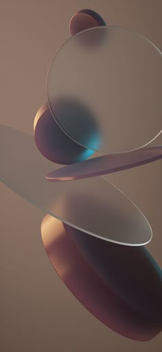 an abstract image of three circular objects floating in the air and reflecting on the ground