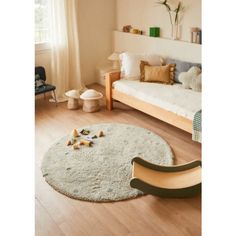 a child's room with a bed, chair and rug