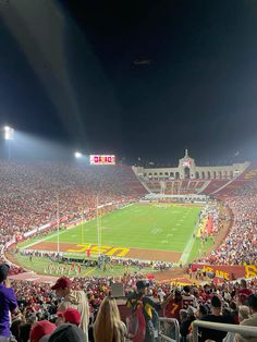 a stadium full of people watching a football game