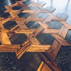 the floor is made out of wood and has an interesting pattern on top of it