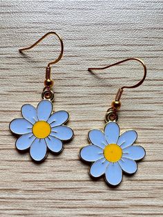 Add to your style with this cute blue flower earrings with gold color hook!  > Size: please see picture for detail > Each pair comes with clear silicone back  > Please keep in mind that color might appear slightly different in person.  If you have any questions, please feel free to send me a message before placing an order :) > Please handle with care > Free standard domestic shipping for over $35!! > Orders will be shipped within 1-3 business days > Thank you for visiting my shop 💙Happy Shopping! Cute Gold Flower Charm Earrings, Cute Gold Flower Earrings For Spring, Trendy Blue Flower Earrings, Trendy Blue Flower Shaped Jewelry, Cute Gold Flower-shaped Earrings, Cute Blue Hypoallergenic Earrings, Cute Blue Flower Shaped Jewelry, Cute Blue Flower Jewelry, Blue Flower Charm Earrings For Spring