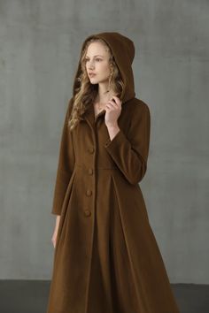 Few things will make you want to leave your house on a chilly day, but gladly this Linennaive vintage tailored wool coat will provide the encouragement you need. Crafted with a mid-calf length and a thick wool construction this tailored outwerwear ensures you'll remain perfectly comfortable on even the chilliest of day Fit And Flare Coat, Hooded Wool Coat, Long Coat Jacket, Linen Fashion, My Fair Lady, Fair Lady, Coat Vintage, Coat Winter, Camel Coat