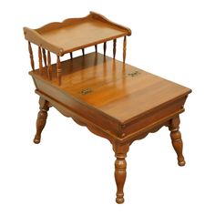 an antique wooden desk with two chairs on each side and one chair at the top