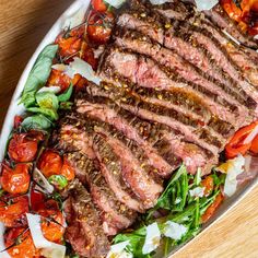 steak and vegetables on a platter ready to be eaten