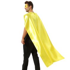 a man wearing a yellow cape and black pants