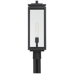 a black post light with a clear glass cover on the top and bottom part, in front of a white background