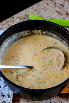 a bowl of soup with a spoon in it