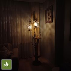 a lamp that is sitting on top of a stand in the corner of a room