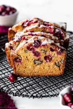 cranberry bread with icing on a cooling rack