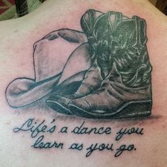 a woman with a tattoo on her back saying life's a dance you learn as you go