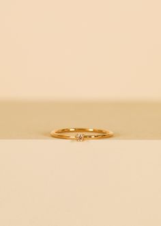 Perfect for making a subtle yet stylish statement. This elegant pinky ring features a dainty, champagne cz centerpiece with a sleek band that comfortably hugs the pinky finger, adding a touch of style to any ensemble. Champagne Cubic Zirconia18kt gold over brassBand width approx 1 mm Setting approx 2 mmSizes 3,4,5 Pinky Promise Ring, Pinky Finger, Pinky Rings, Crystal Stickers, Earring Stand, Jewelry Candles, Custom Ring, Crystal Candles, Pretty Rings