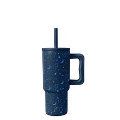 a blue travel mug with stars and crescents on it, in front of a white background