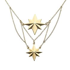 three pieces of gold necklaces on a white background, with one piece in the shape of a star