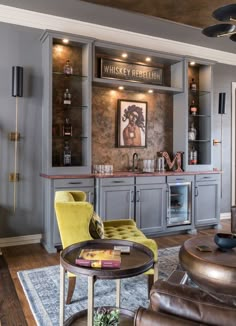 a living room filled with furniture and a bar