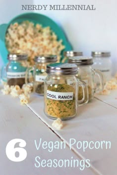 six vegan popcorn seasonings in mason jars with text overlay that reads, 6 vegan popcorn seasonings