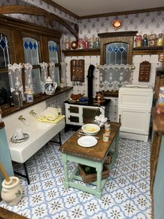 a dollhouse kitchen with blue and white tile flooring on the walls, sink, stove, oven, cabinets, and countertop