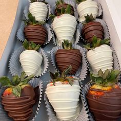 chocolate covered strawberries are arranged in a box