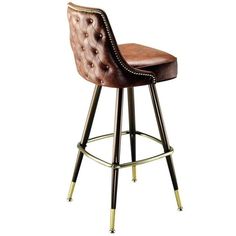 an upholstered bar stool with gold trimmings and leather seat, against a white background