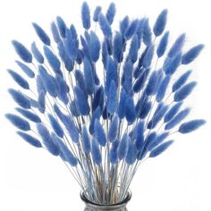 a vase filled with blue flowers on top of a table