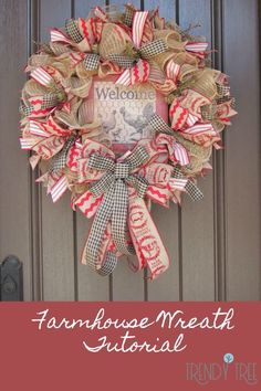 a welcome wreath hanging on the front door with words and ribbons in red, white and green