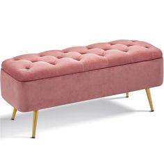 a pink bench sitting on top of a white floor next to a wooden legrest