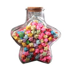 a star shaped glass bottle filled with small colored stars in it's top, on a white background