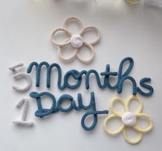 there are three crochet flowers and the words 5 months day written in it