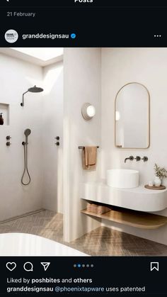 a white bathroom with two sinks and a large mirror above the sink is featured on instagram