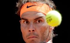 a tennis player is about to hit the ball with his racket and headband