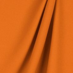 an orange plain fabric that is very soft