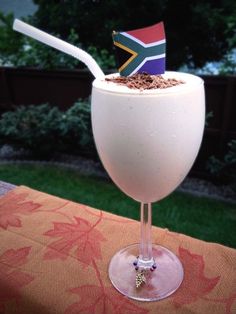 a drink with a flag sticking out of it