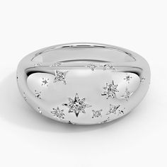 a white gold ring with stars on it