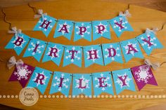 a happy birthday banner with snowflakes on it