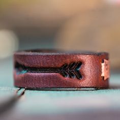 a ring with an arrow engraved on it