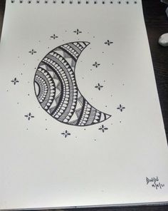 a drawing of a crescent moon on paper