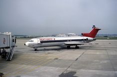 an airplane parked on the tarmac at an airport