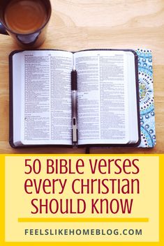 an open bible on top of a wooden table next to a cup of coffee with the words 50 bible verses every christian should know