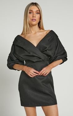 Show off a sexy sophistication in the Anastasija Dress! This stunning mini dress has a sculptural off-the-shoulder neckline, elbow-length puff sleeves and a fitted waist with darts at the skirt for a slim fit. It's highly chic and perfect to wear for special events or occasions. Pop it on for date night with layered necklaces, hoops and some sleek heels!Product DetailsInvisible zipper on the centre backOff-the-shoulder V-necklineElbow-length balloon sleeves with elasticated cuffsGathered bodice& Off Shoulder V Neck, Black Dress Outfit Party, Gathered Bodice, Black Dress Outfits, Pop It, Balloon Sleeves, Fancy Dresses, Invisible Zipper, V Neck Dress