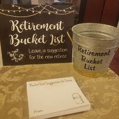 an old bucket sits next to a sign that says retirement bucket list leave a suggestion for the new refiree