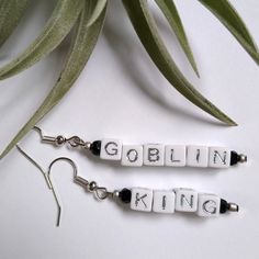 "\"You remind me of the babe...\"  Jareth the Goblin King, ruler of the Labyrinth--wear him on your ears! White beads with silver letters, jet black glass beads, and tiny silver glass beads. The metallic silver letters and black beads are lovely and sparkly! Rubber backings included for secure wearing." Letter Bead Earrings, Jewelry King, Goblin King, Letter Beads, Earrings Photo, Labyrinth, White Beads, Beading Tutorials, Black Beads