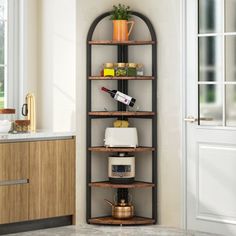 a corner shelf in the middle of a kitchen